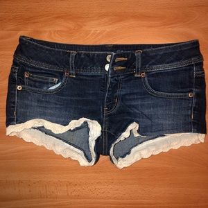 American Eagle - low rise,  denim shorts. With lace accent. Size 6.